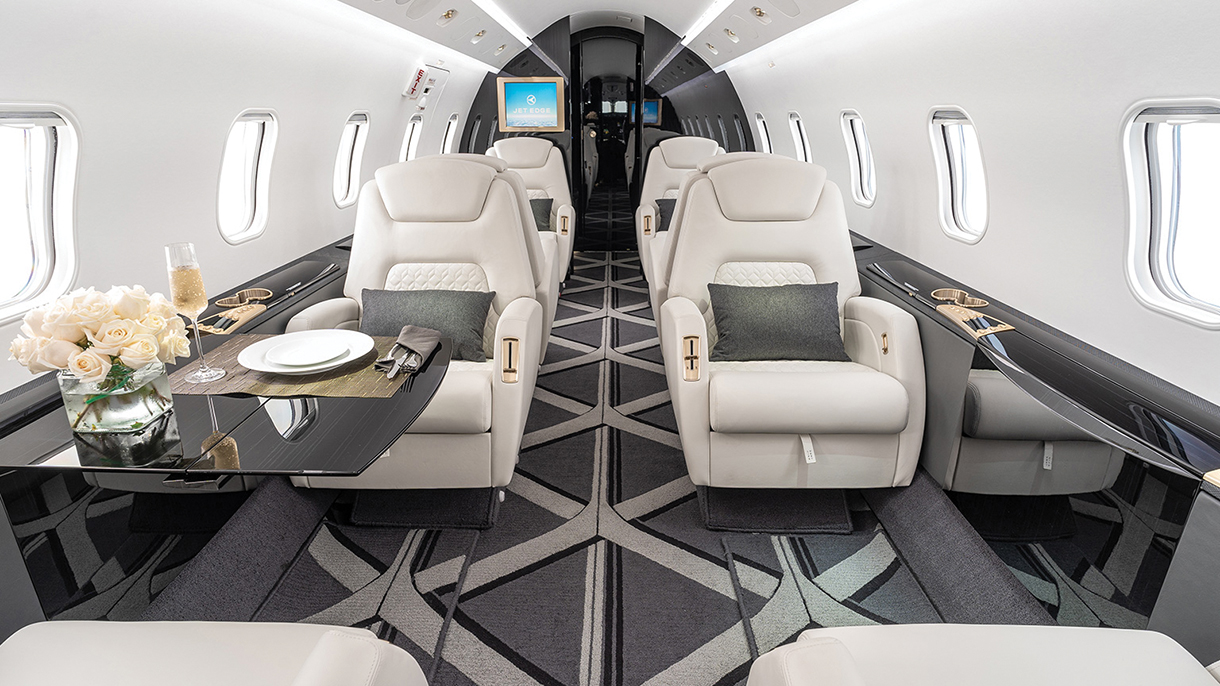 Black, gray, and white private jet interior from Jet Edge